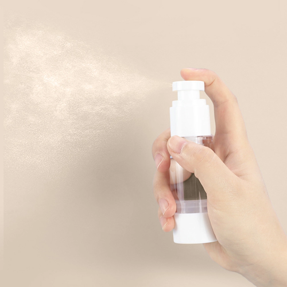 Close-up of airless pump dispenser releasing a gentle spray