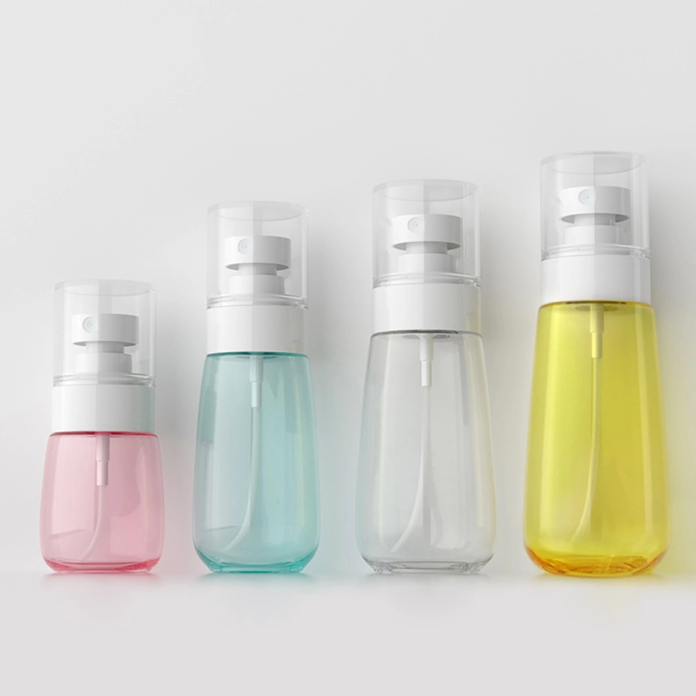Four colorful PETG fine mist spray bottles with clear overcaps