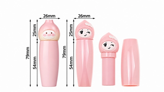 Pink cosmetic tubes with cute character caps shown assembled and separated; dimension markings indicate a total height of 79 mm, a width of 26 mm, and a cap height of 25 mm.